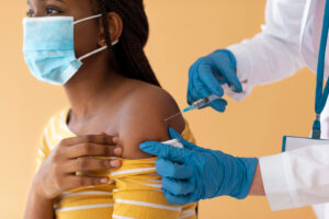 Tanzanian health workers conduct screening and treatment for neglected tropical diseases during a community health campaign in Dar es Salaam.